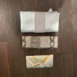 Three neutral clutches. One reptile print, one silver, one fun pattern.